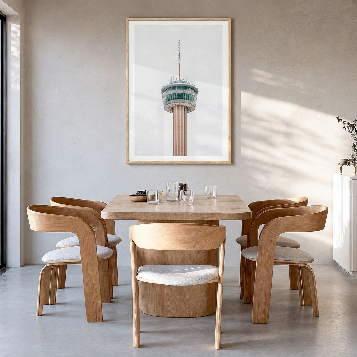 Tower of the Americas Photo Poster in a natural wood frame, hanging in a dining room, white border
