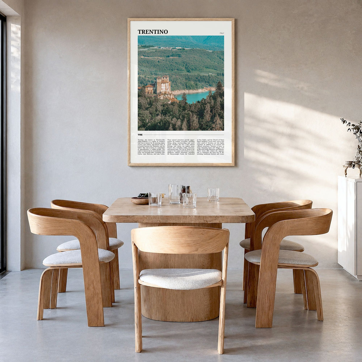 Trentino Travel No 1 Poster in a natural wood frame, hanging in a dining room