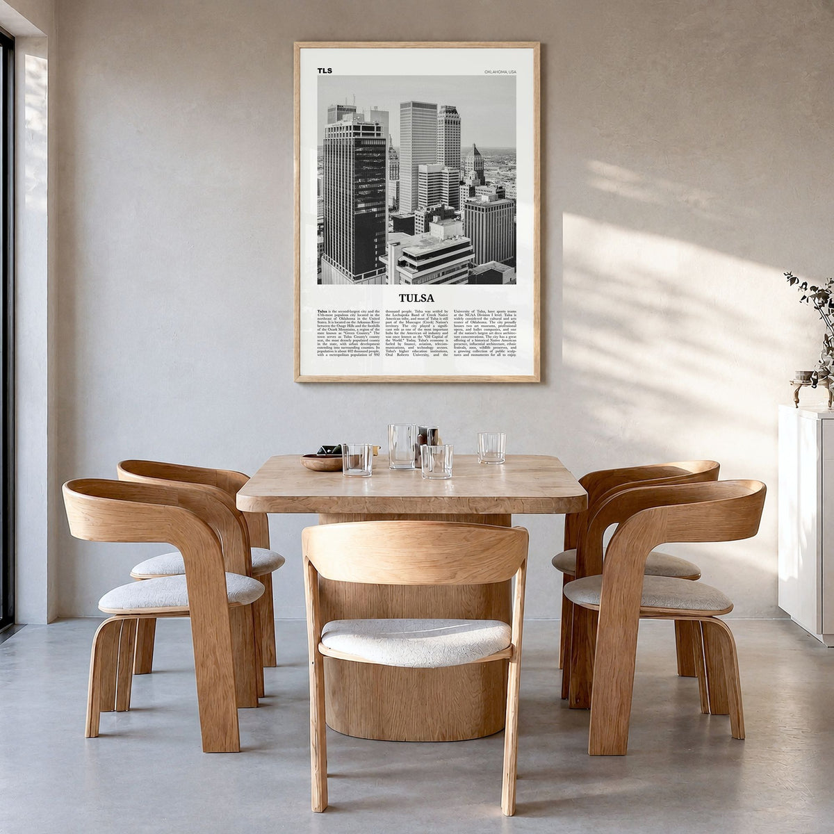 Tulsa Newspaper Poster in a natural wood frame, hanging in a dining room