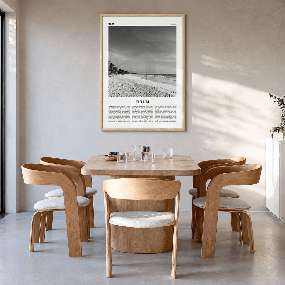 Tulum Newspaper No 1 Poster in a natural wood frame, hanging in a dining room