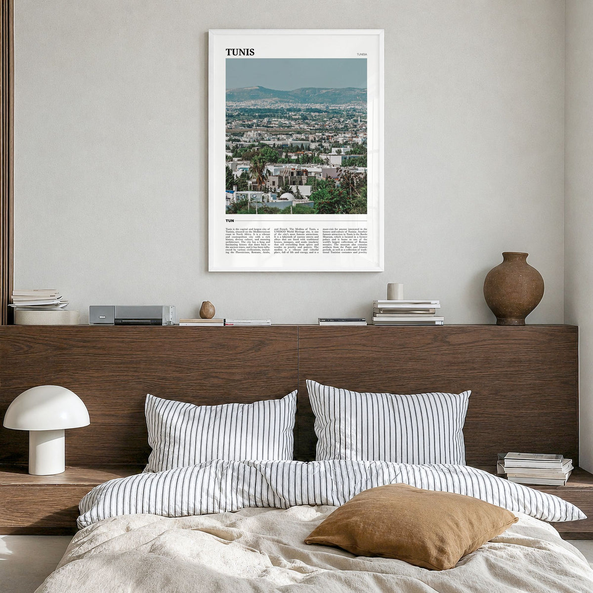 Tunis Travel Poster in a white wood frame, hanging in a bedroom