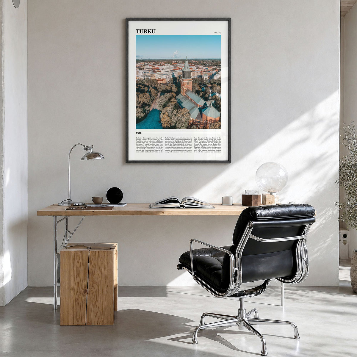 Turku Travel Poster in a black wood frame, hanging in a bright home office