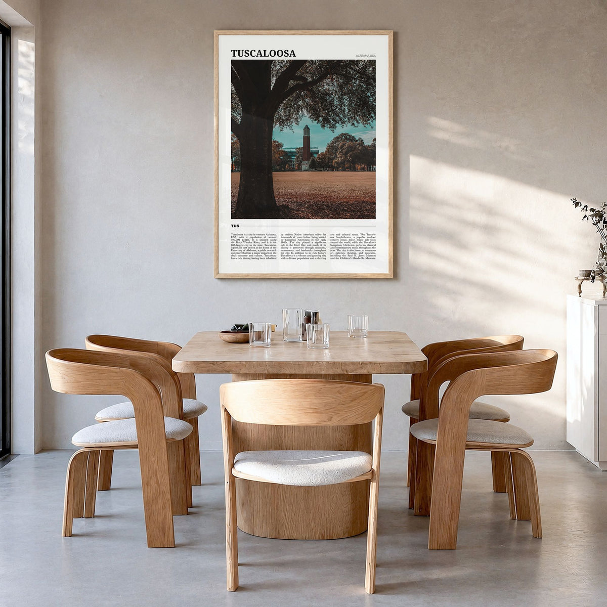 Tuscaloosa Travel Poster in a natural wood frame, hanging in a dining room