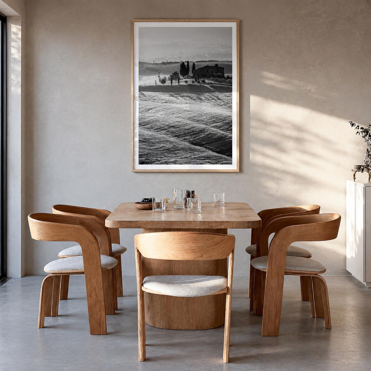 Tuscany no. 1 black & white photo poster of Italy – vertical wall art in natural wood frame with white border, hanging on wal