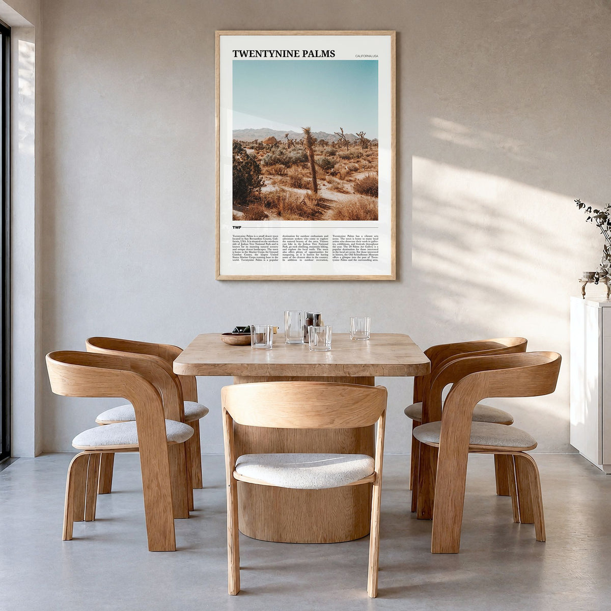 Twentynine Palms Travel Poster in a natural wood frame, hanging in a dining room