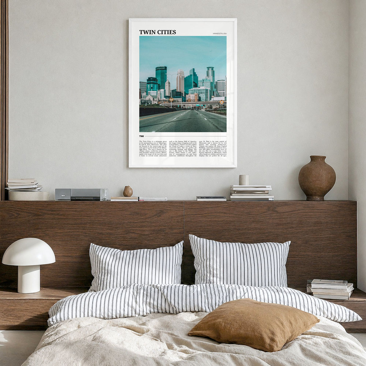 Twin Cities Travel Poster in a white wood frame, hanging in a bedroom