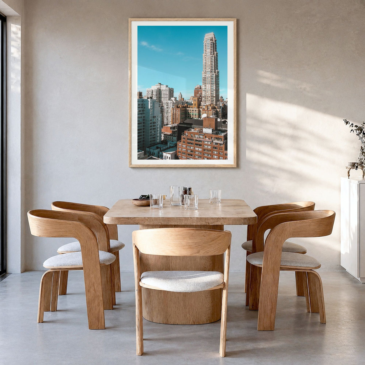 Upper East Side Photo No 2 Poster in a natural wood frame, hanging in a dining room, white border