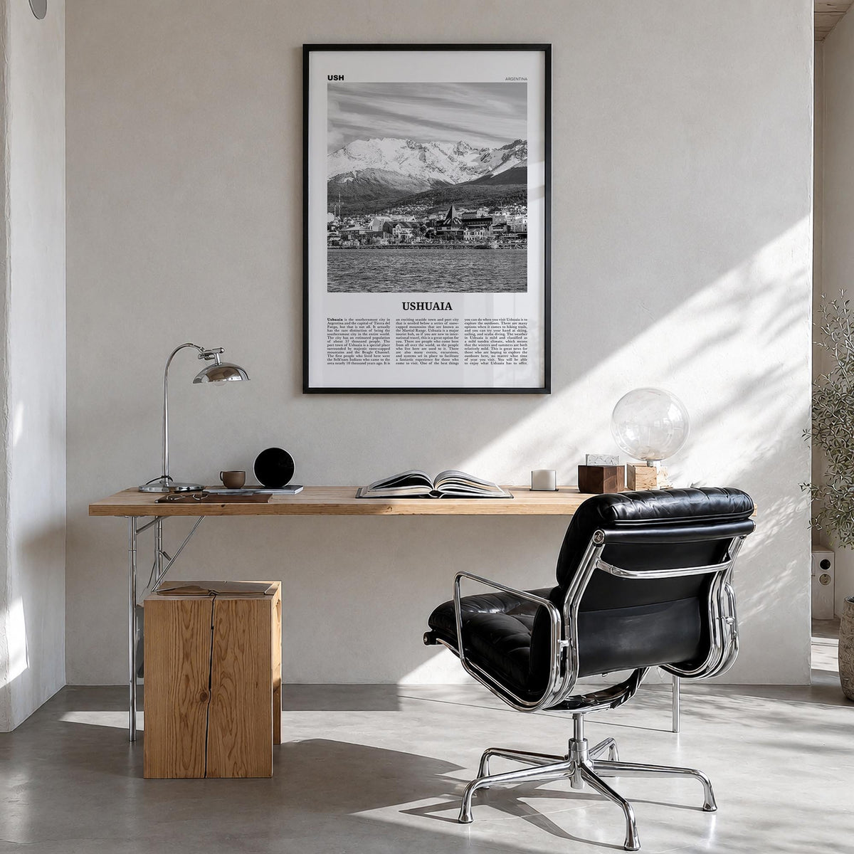 Ushuaia black & white newspaper poster of Argentina – vertical wall art in black wood frame, hanging on wall