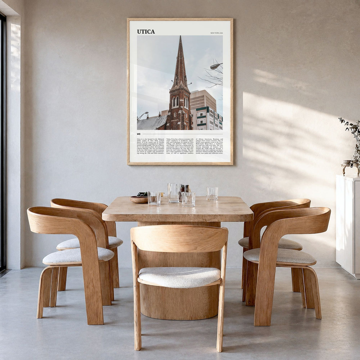 Utica Travel Poster in a natural wood frame, hanging in a dining room