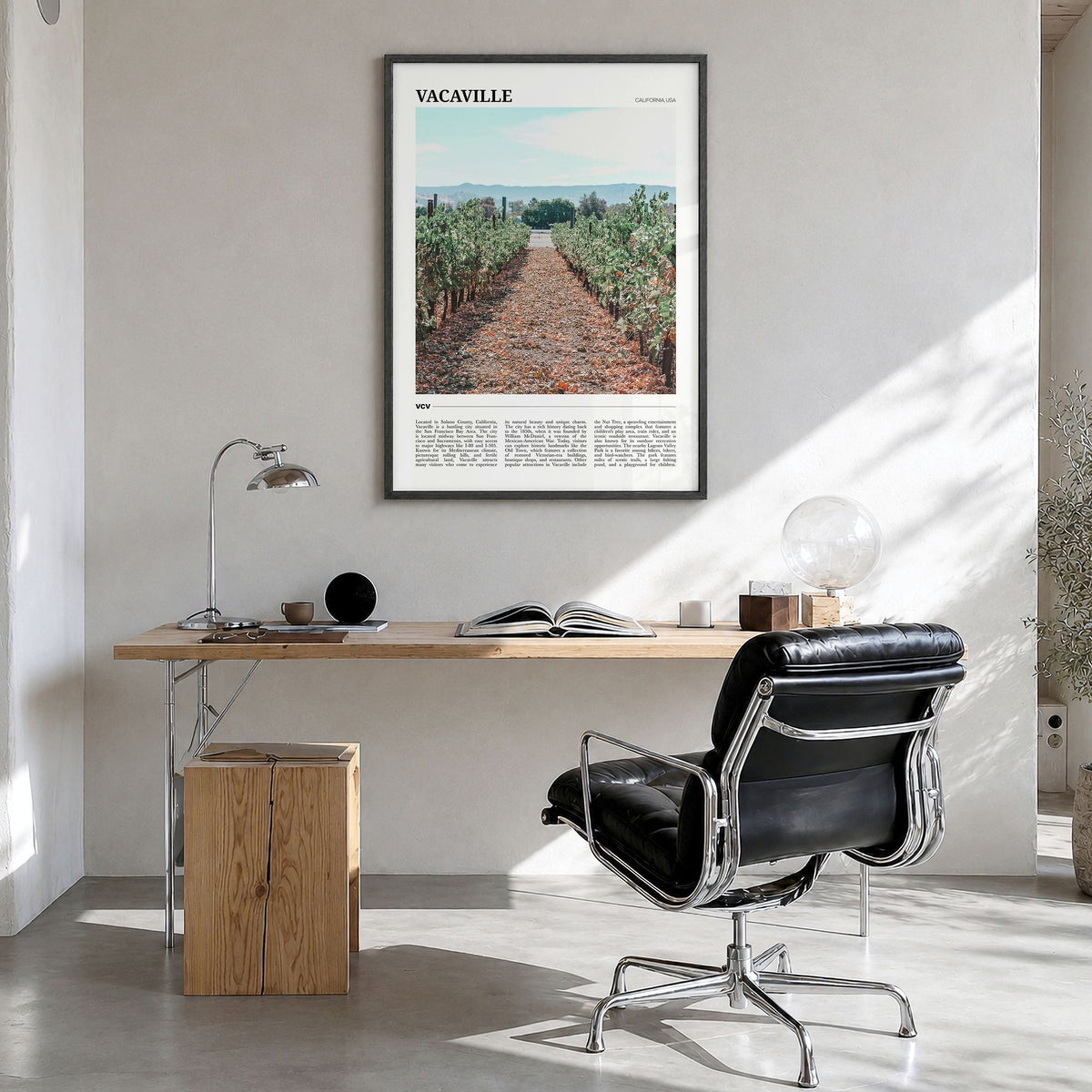 Vacaville Travel Poster in a black wood frame, hanging in a bright home office