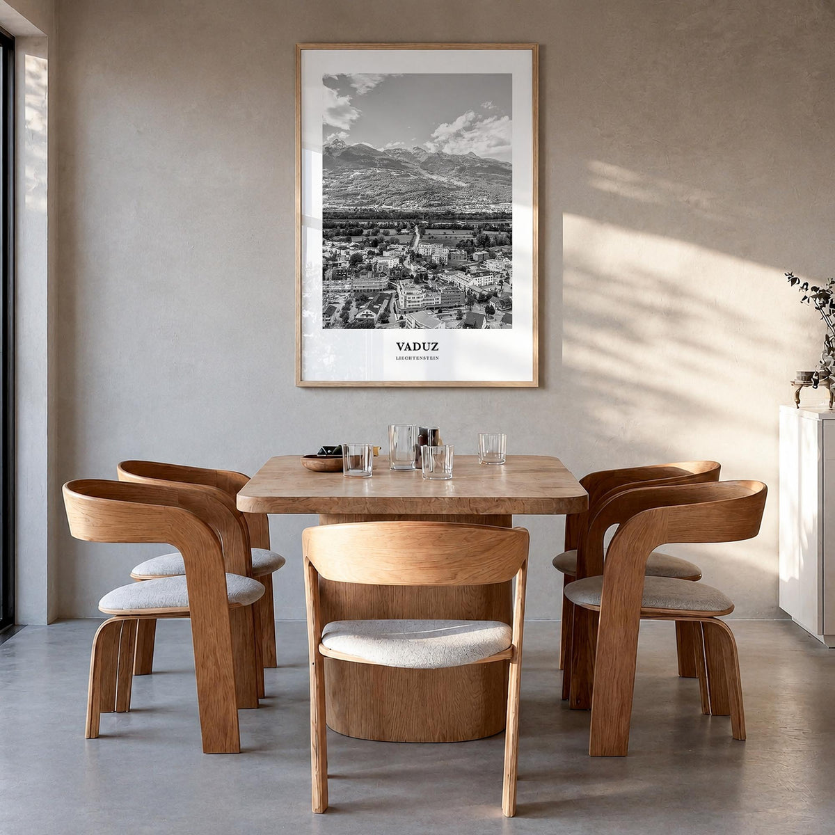 Vaduz black & white classic poster of Liechtenstein – vertical wall art in natural wood frame, hanging on wall