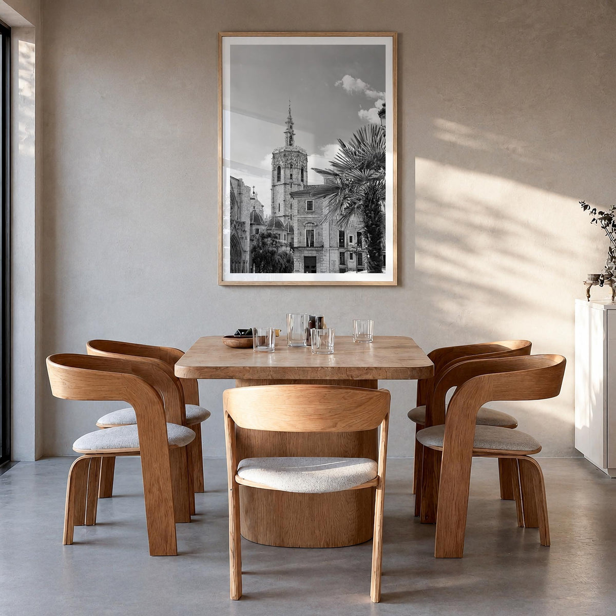 Valencia black & white photo poster of Spain – vertical wall art in natural wood frame with white border, hanging on wall