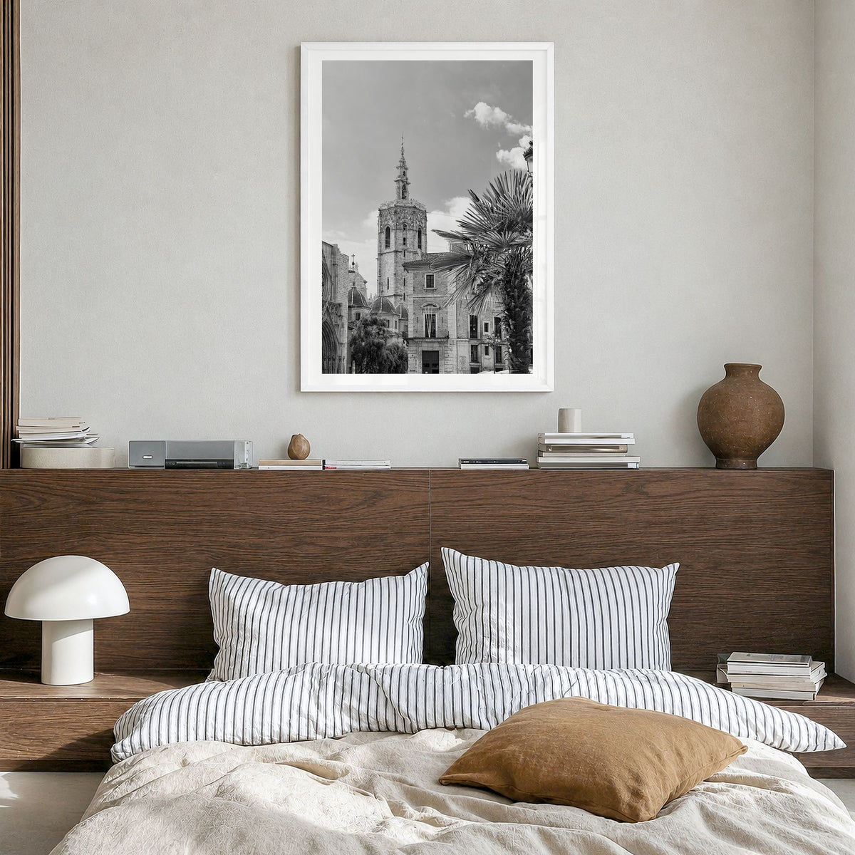 Valencia Photo Poster in a white wood frame, hanging in a bedroom, white border