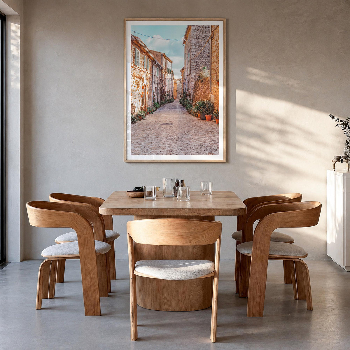 Valldemossa colorful photo poster of Spain – vertical wall art in natural wood frame with white border, hanging on wall