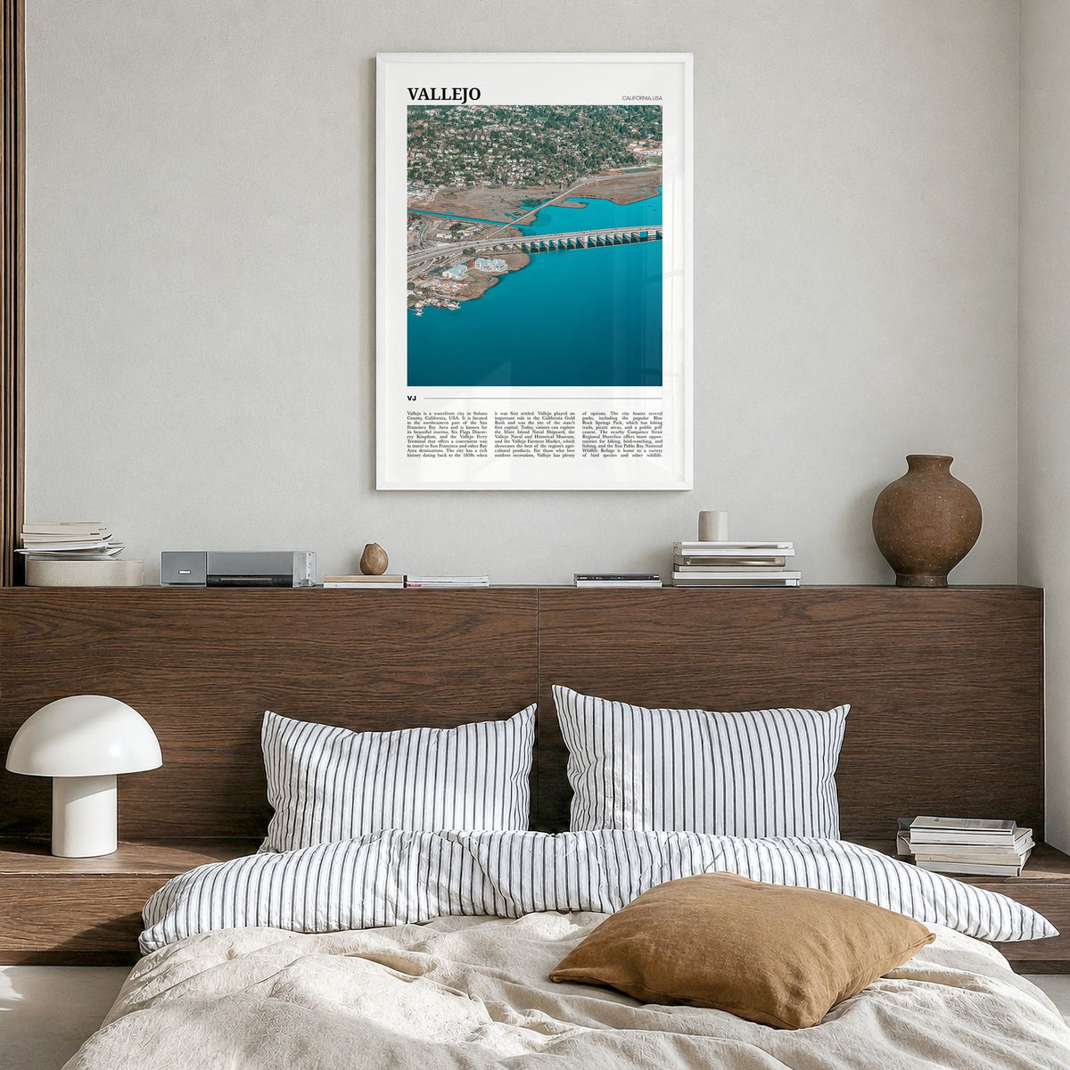 Vallejo Travel Poster in a white wood frame, hanging in a bedroom