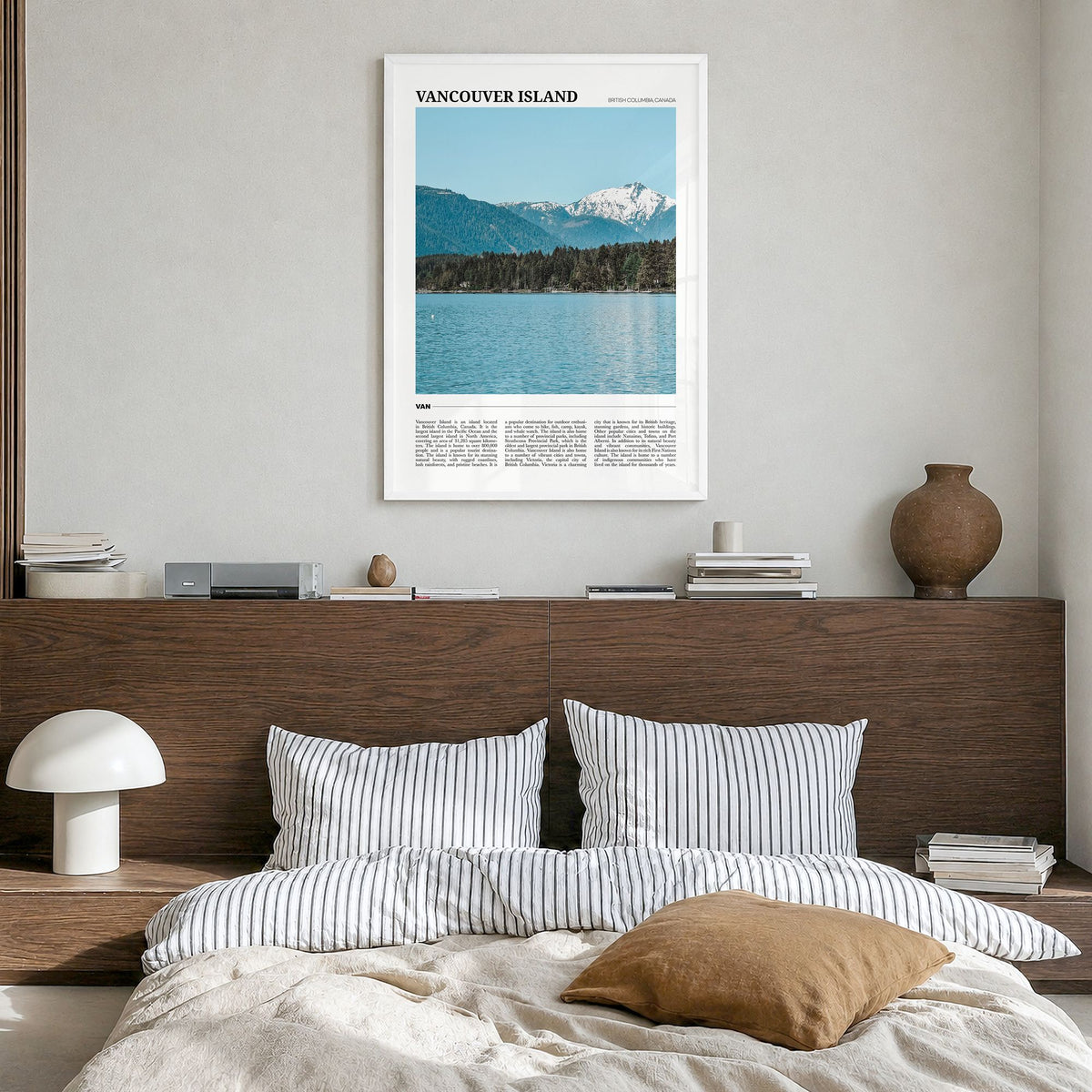 Vancouver Island Travel Poster in a white wood frame, hanging in a bedroom