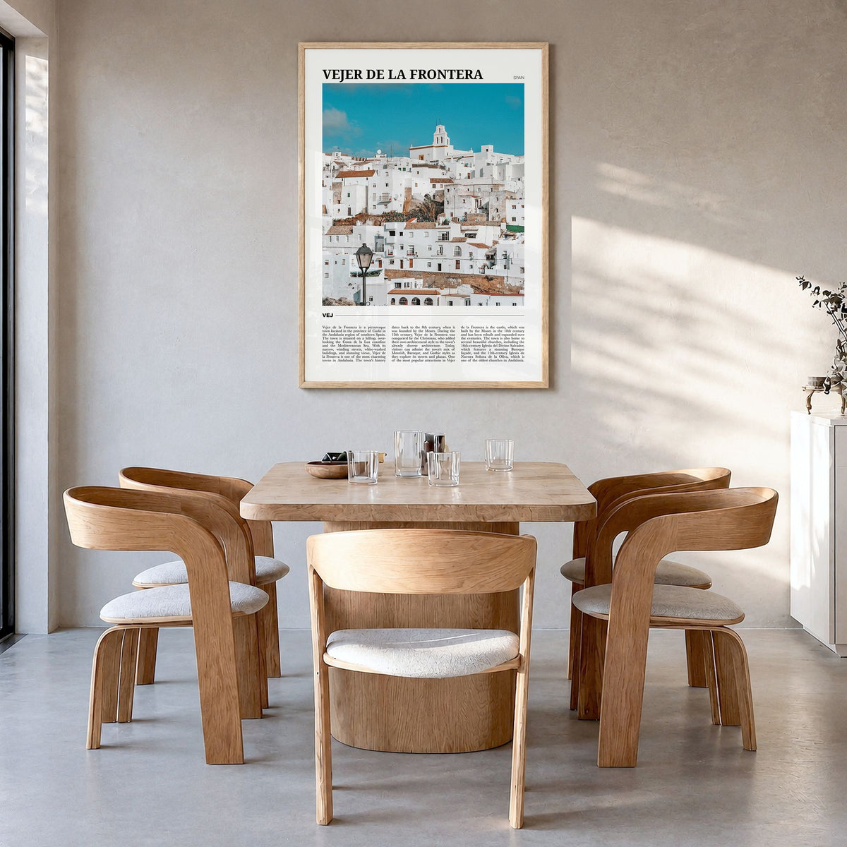 Vejer de la Frontera Travel Poster in a natural wood frame, hanging in a dining room