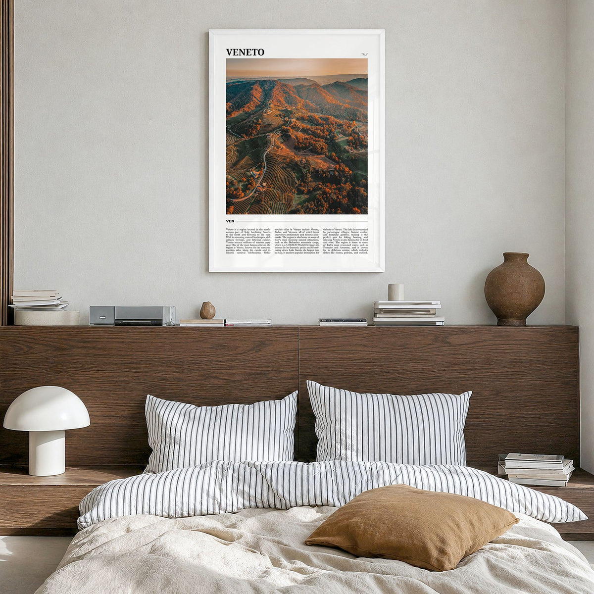 Veneto Travel Poster in a white wood frame, hanging in a bedroom
