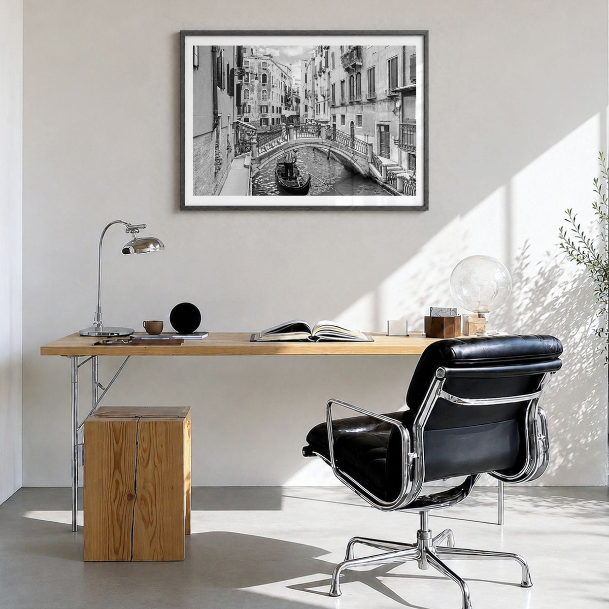 Venice Photo Poster in a black wood frame, hanging in a bright home office, white border