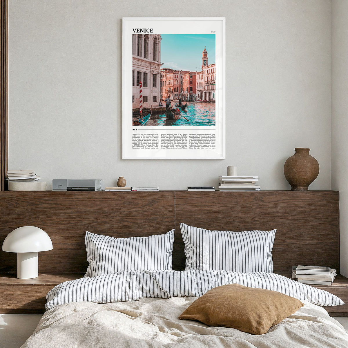 Venice Travel Poster in a white wood frame, hanging in a bedroom