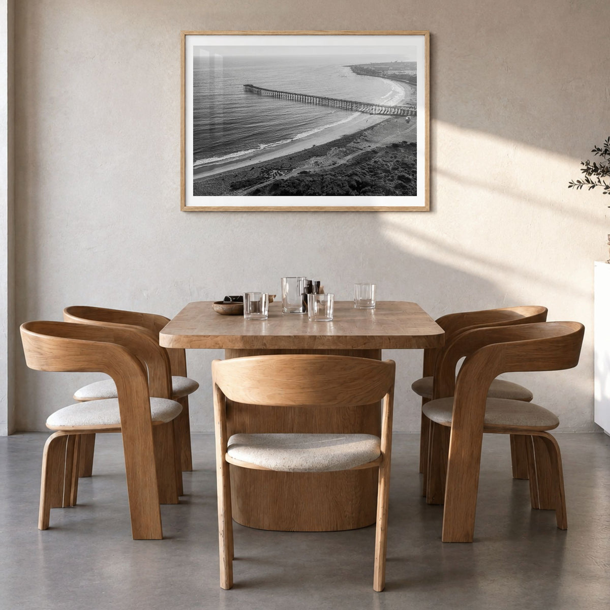 Ventura Photo No 1 Poster in a natural wood frame, hanging in a dining room, white border