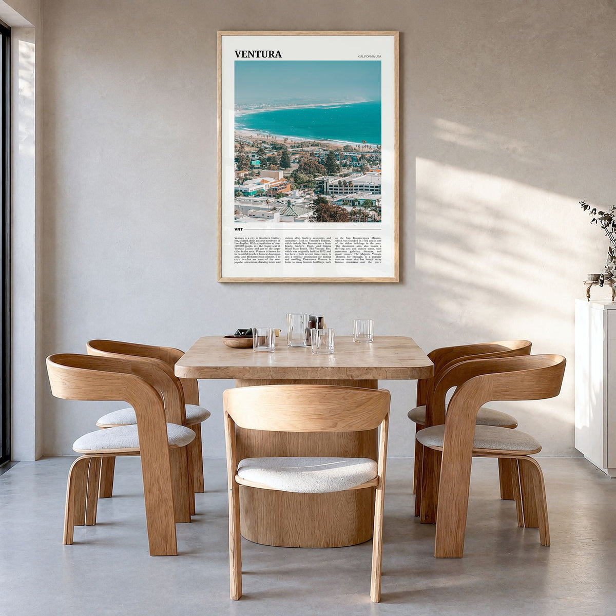Ventura Travel No 2 Poster in a natural wood frame, hanging in a dining room