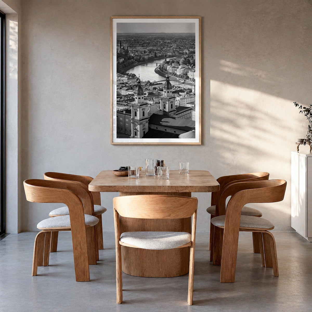 Vienna black & white photo poster of Austria – vertical wall art in natural wood frame with white border, hanging on wall
