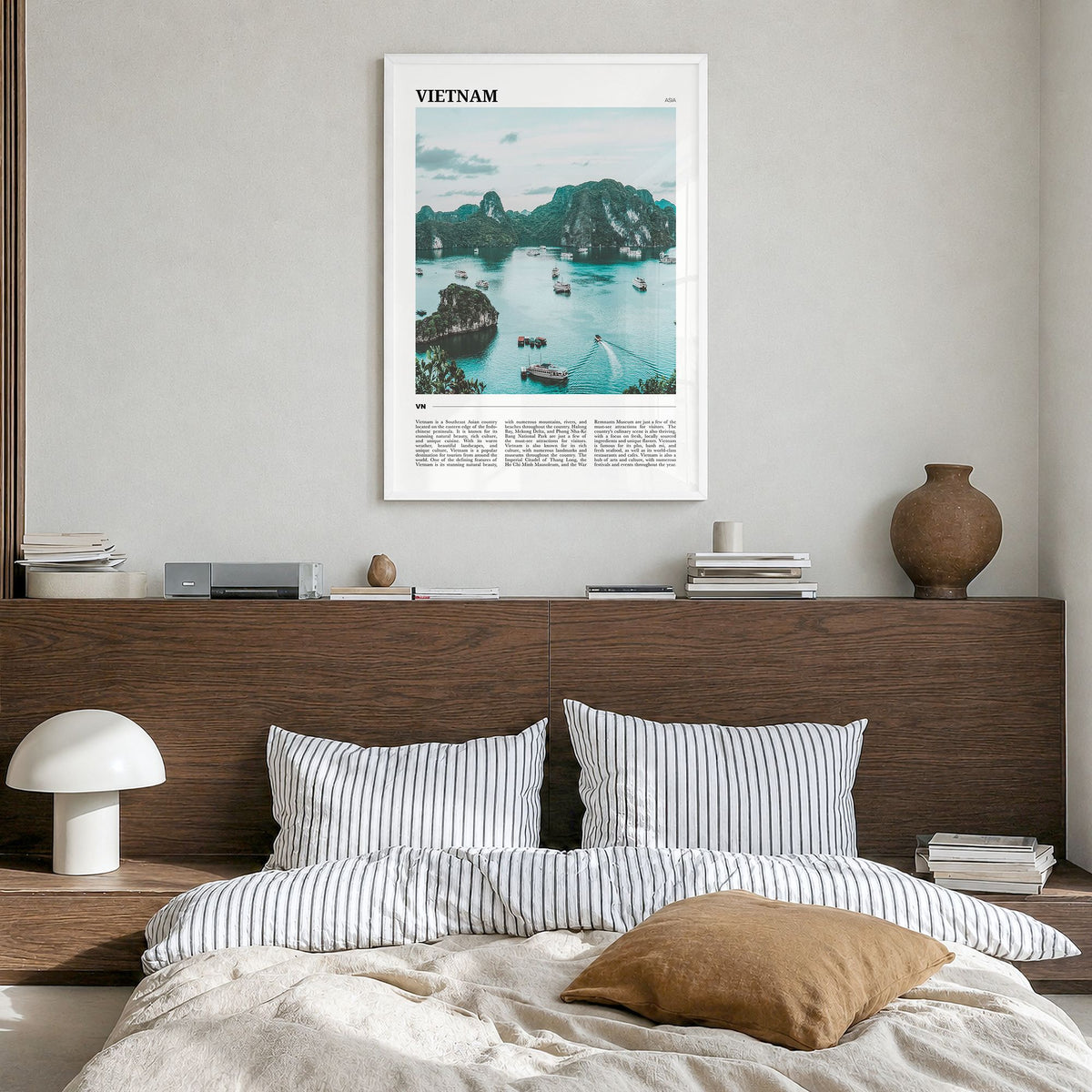 Vietnam Travel Poster in a white wood frame, hanging in a bedroom