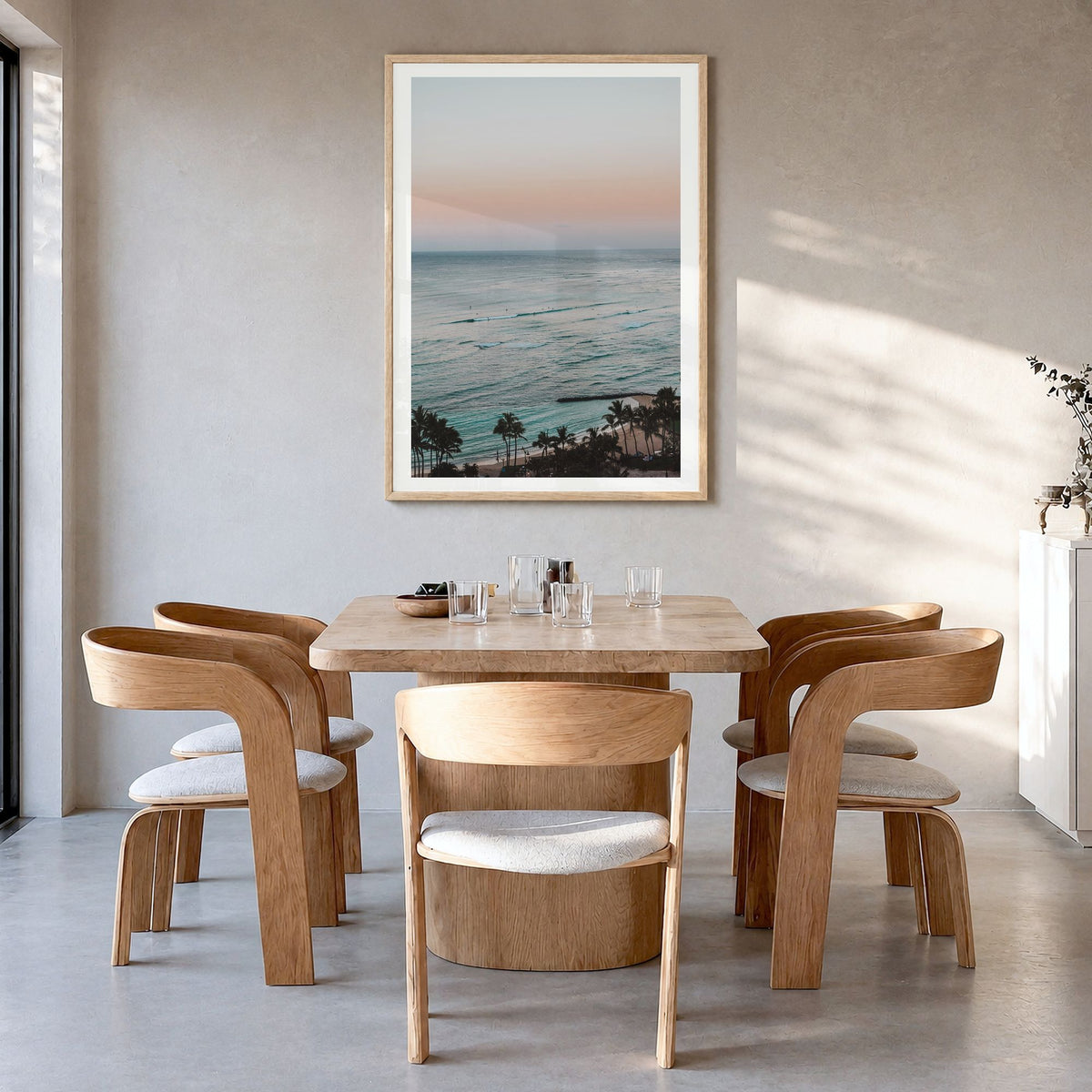 Waikiki Photo No 2 Poster in a natural wood frame, hanging in a dining room, white border