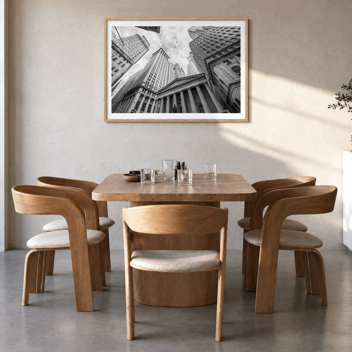 Wall Street Photo Poster in a natural wood frame, hanging in a dining room, white border