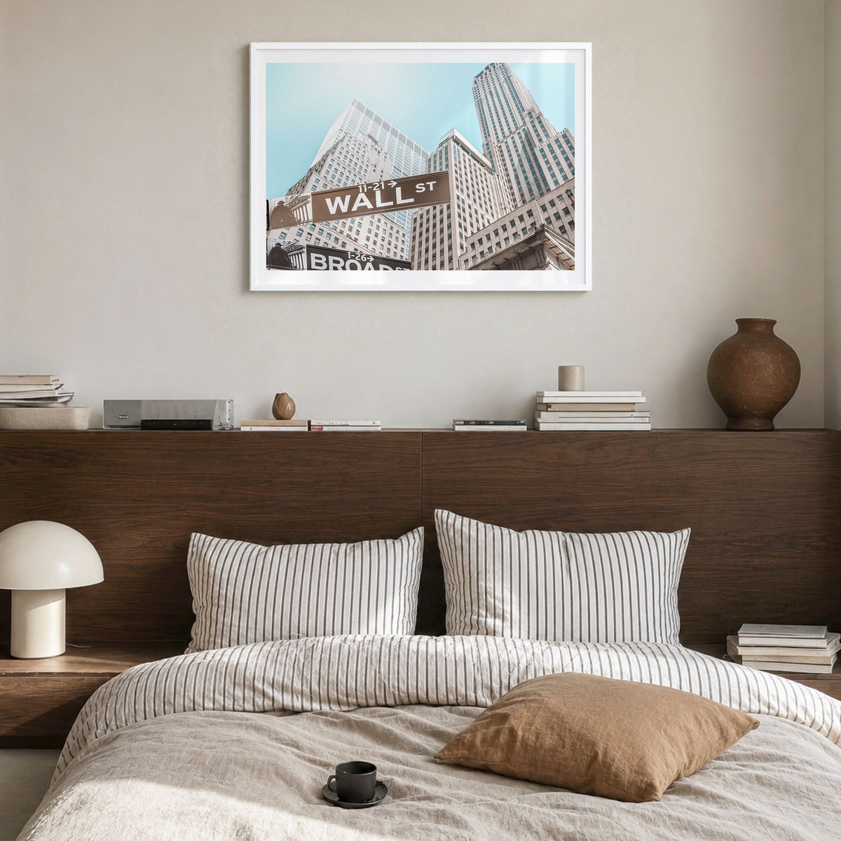 Wall Street Photo Poster in a white wood frame, hanging in a bedroom, white border
