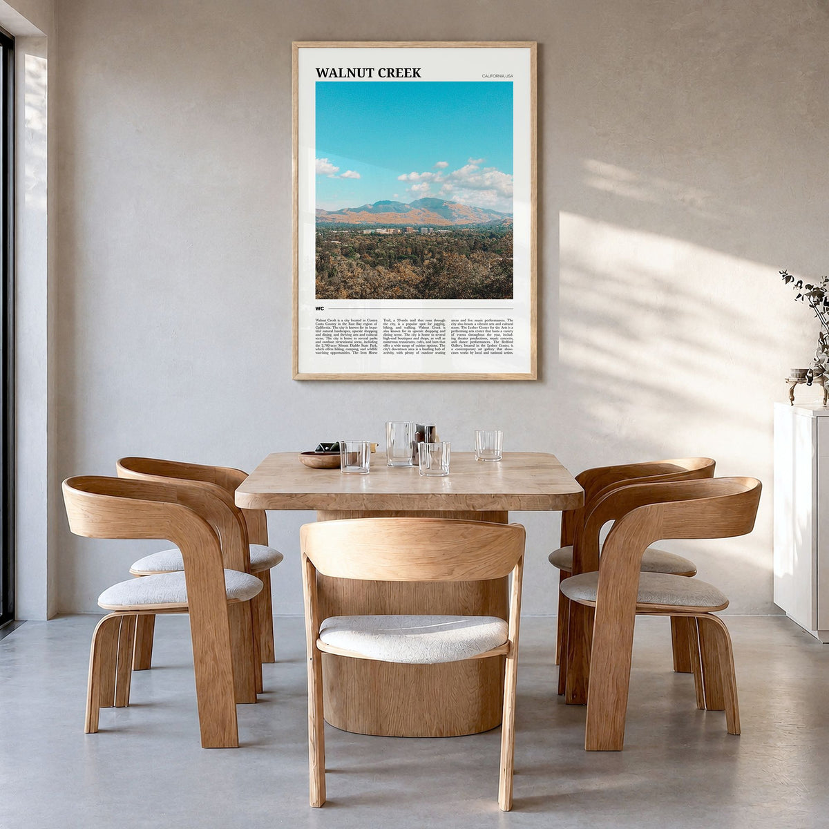 Walnut Creek Travel Poster in a natural wood frame, hanging in a dining room