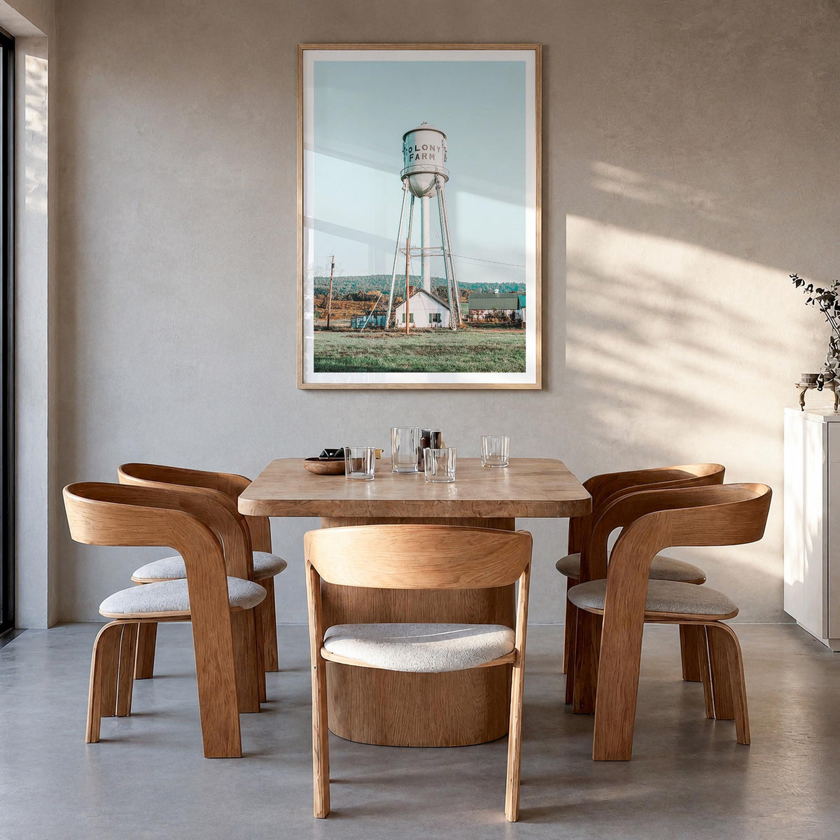 Water Tower no. 1 colorful photo poster – vertical wall art in natural wood frame with white border, hanging on wall