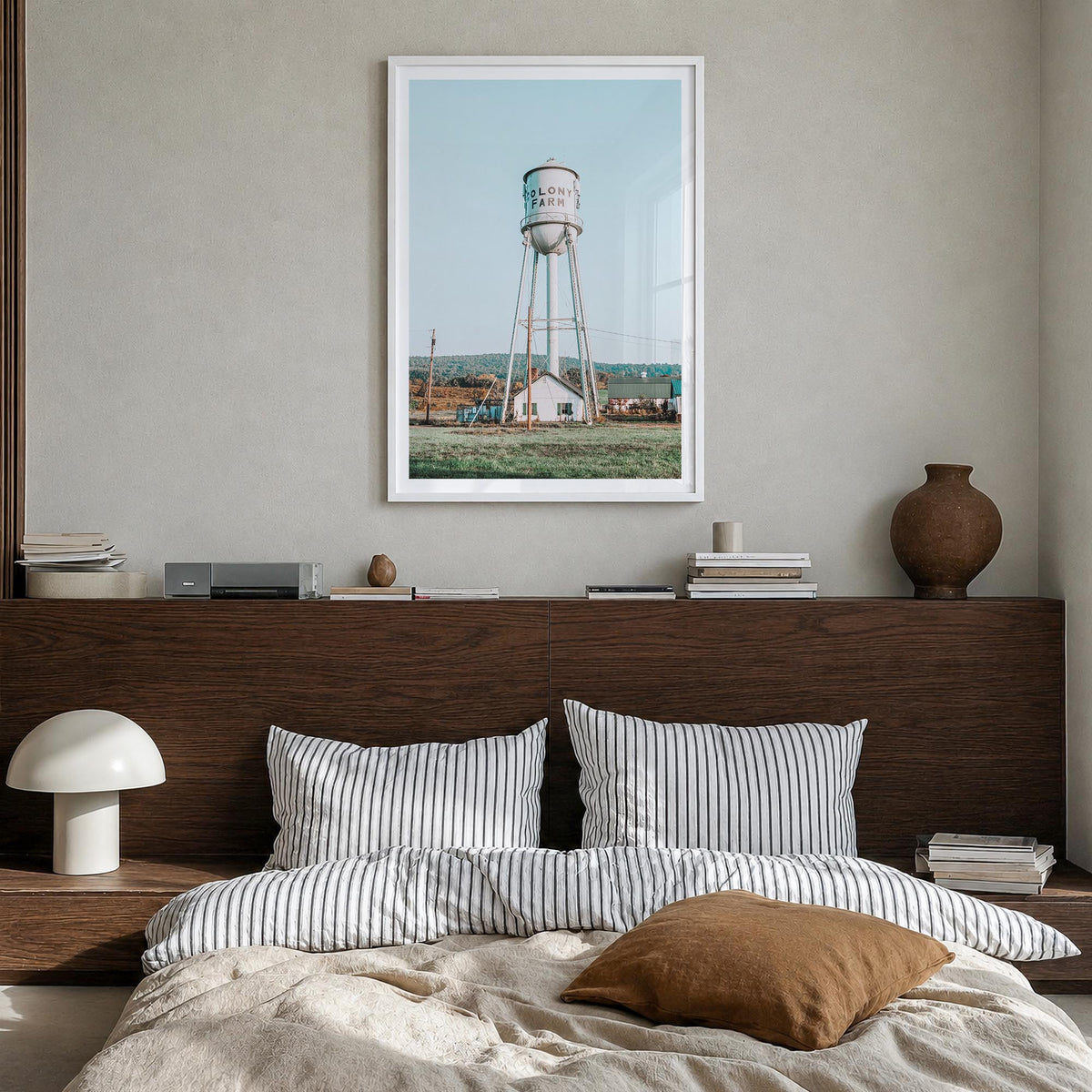 Water Tower no. 1 colorful photo poster – vertical wall art in white wood frame with white border, hanging on wall