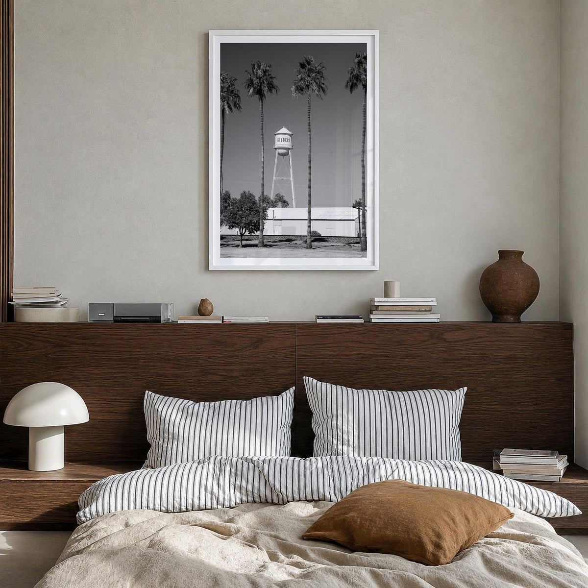 Water Tower no. 2 black & white photo poster – vertical wall art in white wood frame with white border, hanging on wall