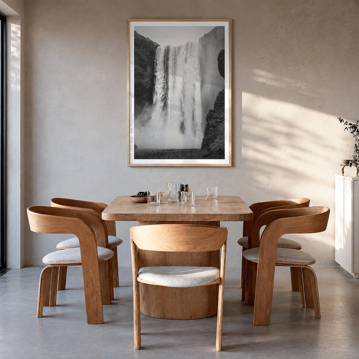 Waterfall no. 1 black & white photo poster – vertical wall art in natural wood frame with white border, hanging on wall