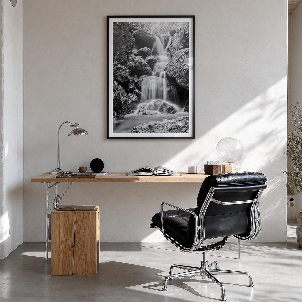 Waterfall no. 2 black & white photo poster – vertical wall art in black wood frame with white border, hanging on wall