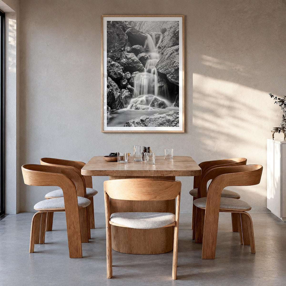 Waterfall no. 2 black & white photo poster – vertical wall art in natural wood frame with white border, hanging on wall