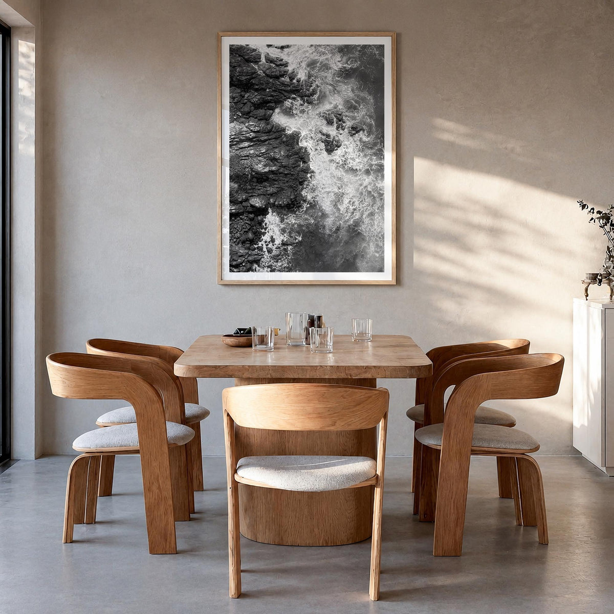 Waves Crashing no. 1 black & white photo poster – vertical wall art in natural wood frame with white border, hanging on wall
