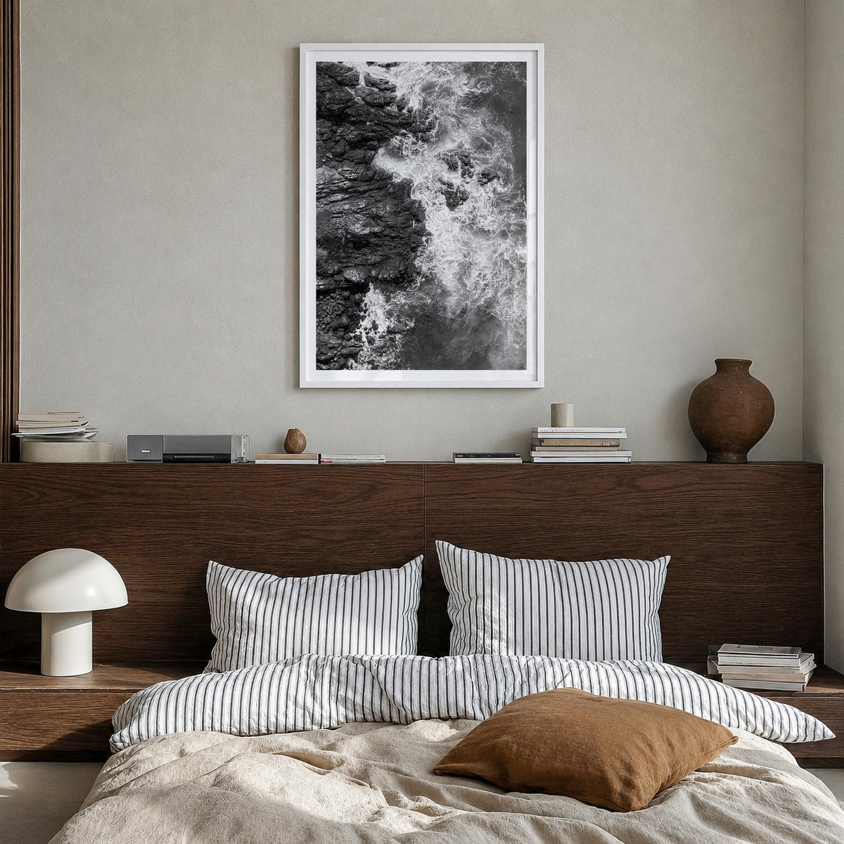 Waves Crashing no. 1 black & white photo poster – vertical wall art in white wood frame with white border, hanging on wall