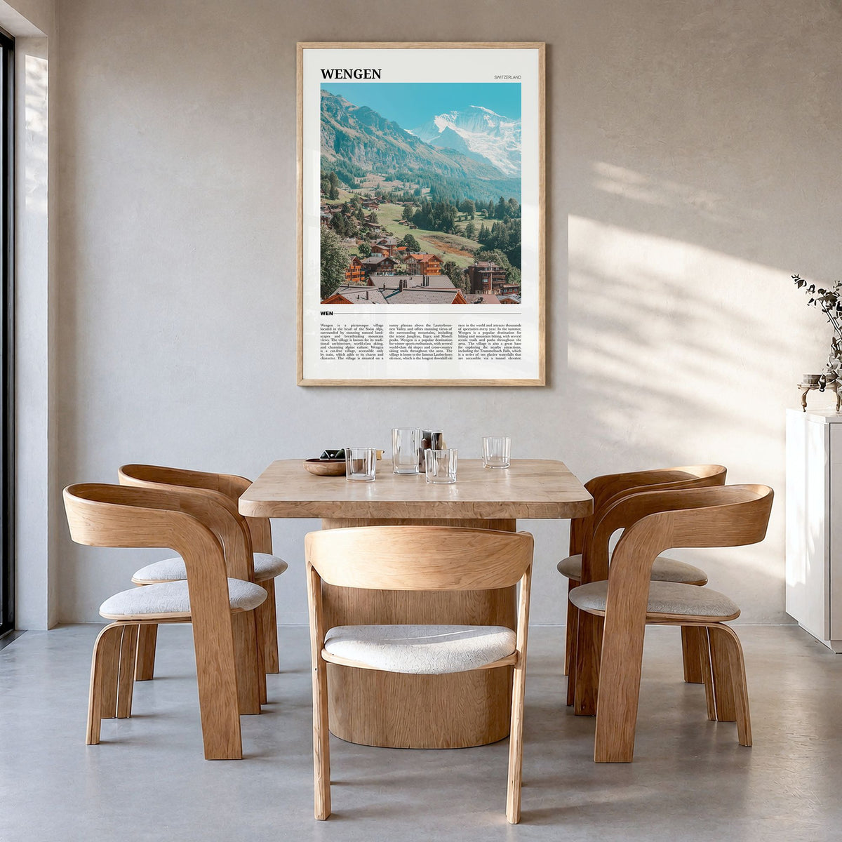 Wengen Travel Poster in a natural wood frame, hanging in a dining room