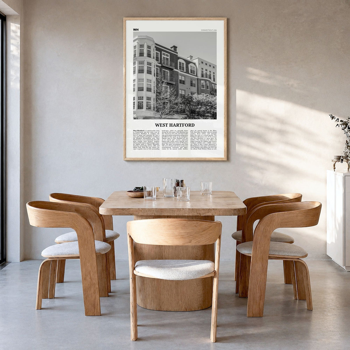 West Hartford Newspaper Poster in a natural wood frame, hanging in a dining room