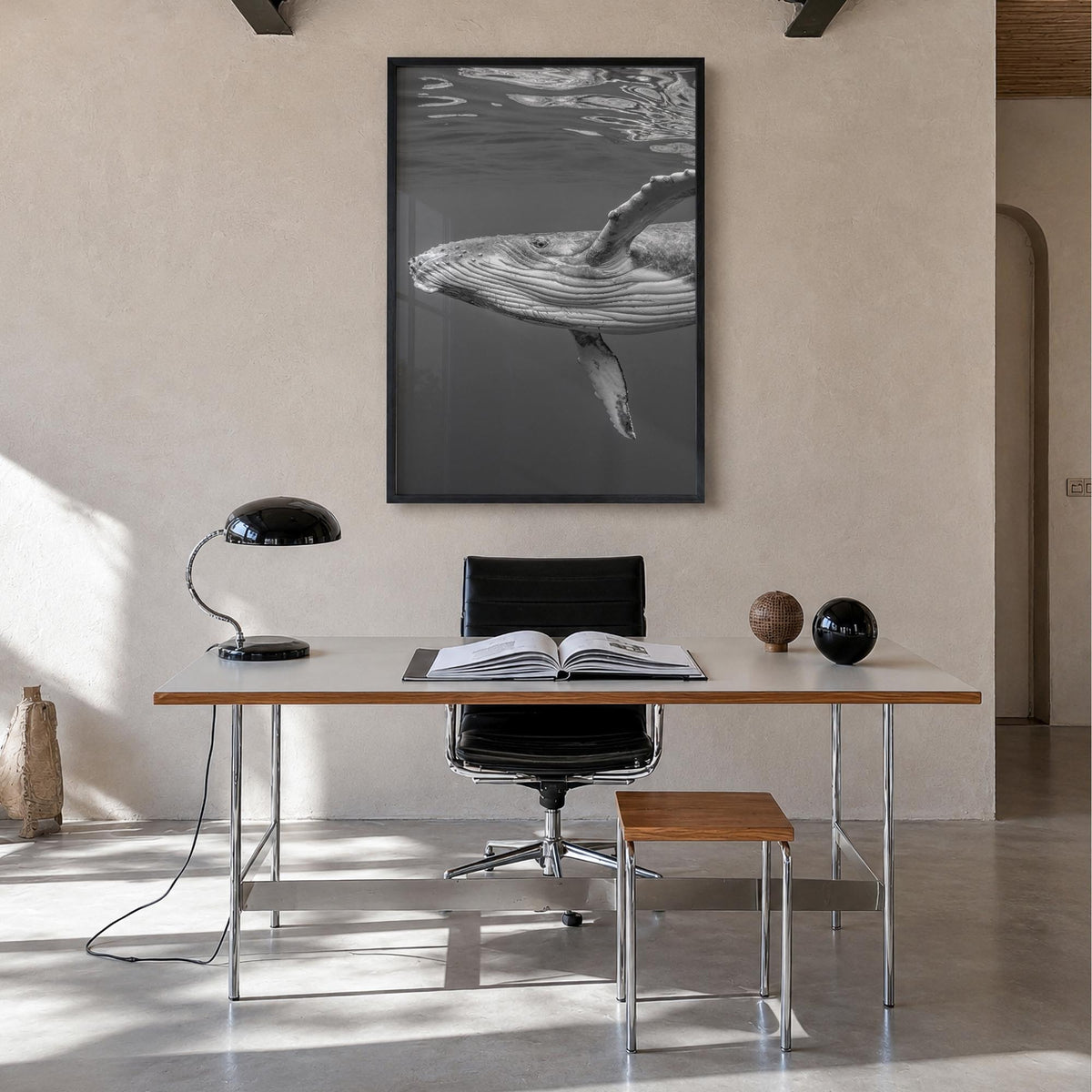 Whale no. 1 black & white photo poster – vertical wall art in black wood frame, hanging on wall