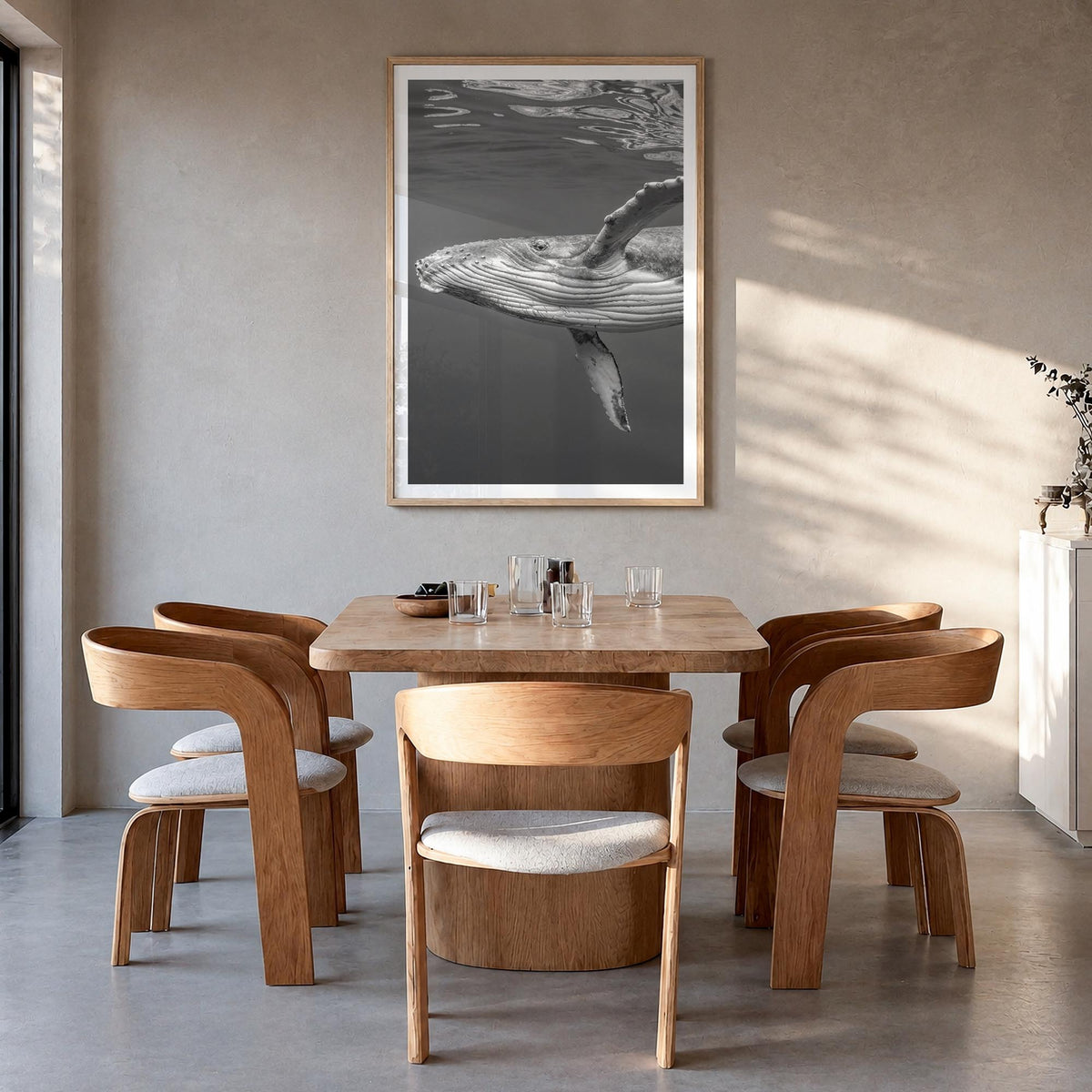 Whale no. 1 black & white photo poster – vertical wall art in natural wood frame with white border, hanging on wall