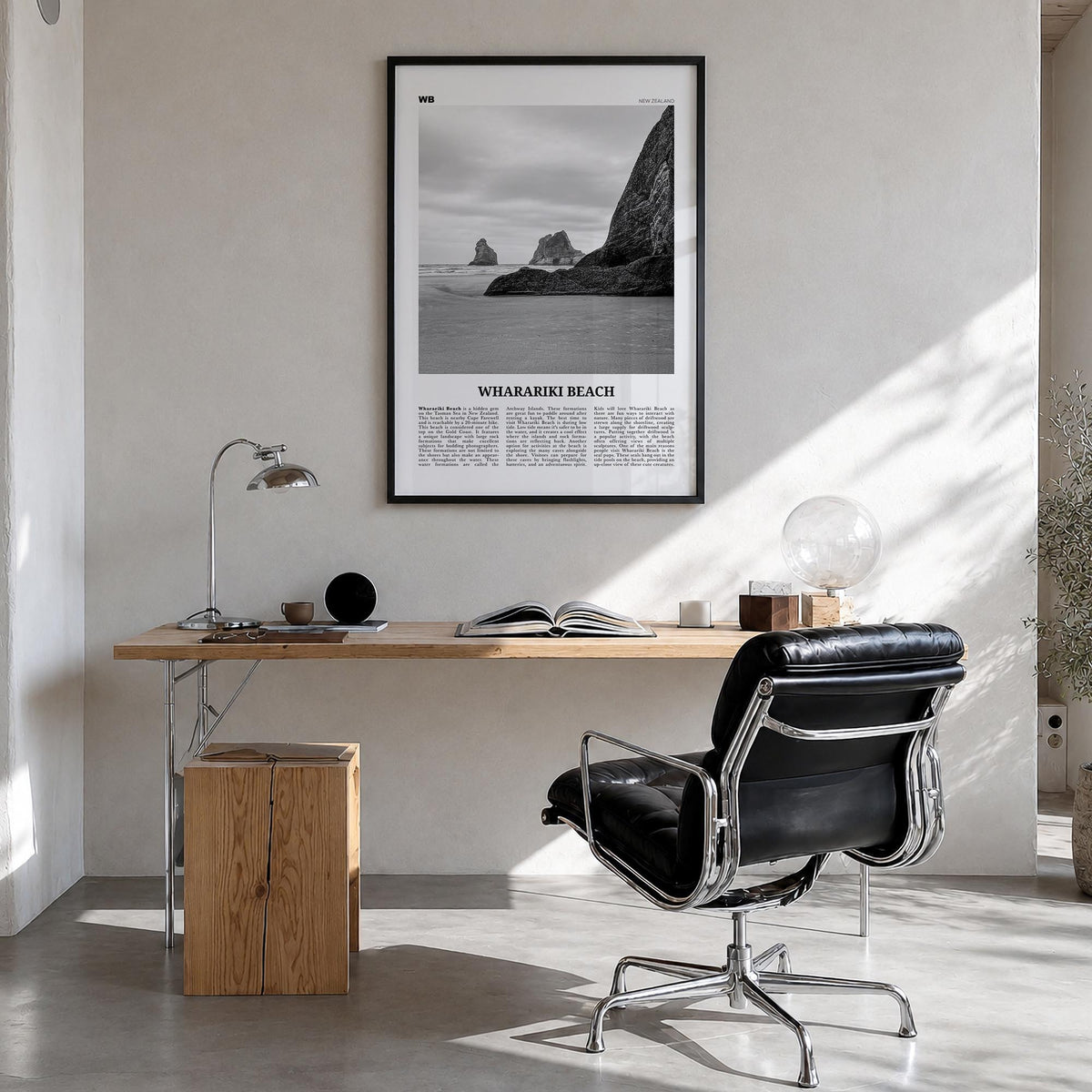 Wharariki Beach black & white newspaper poster of New Zealand – vertical wall art in black wood frame, hanging on wall