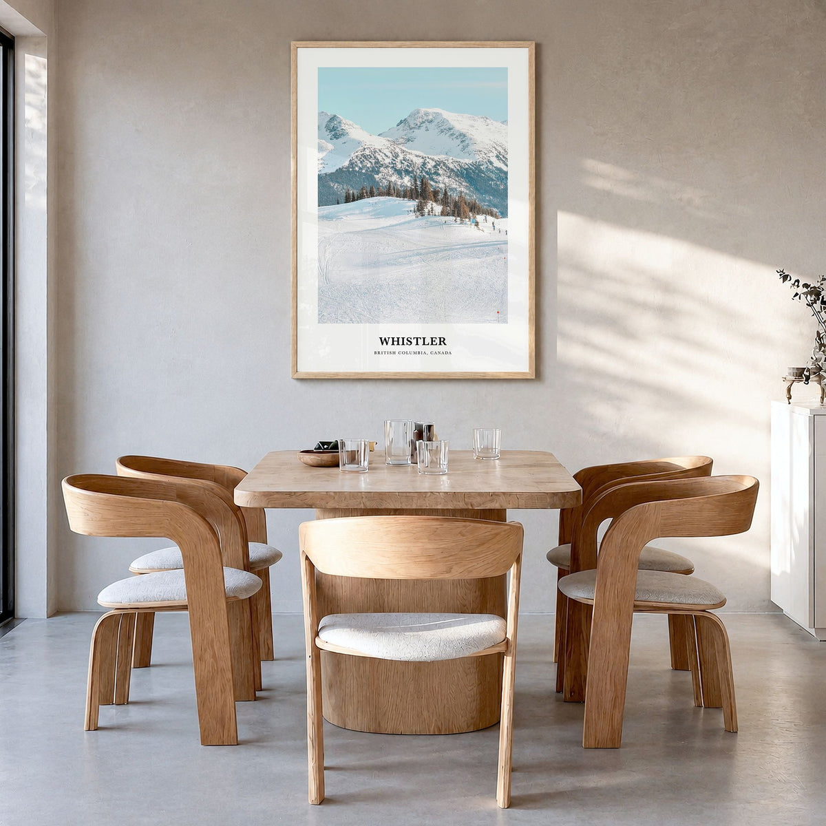 Whistler Classic Poster in a natural wood frame, hanging in a dining room