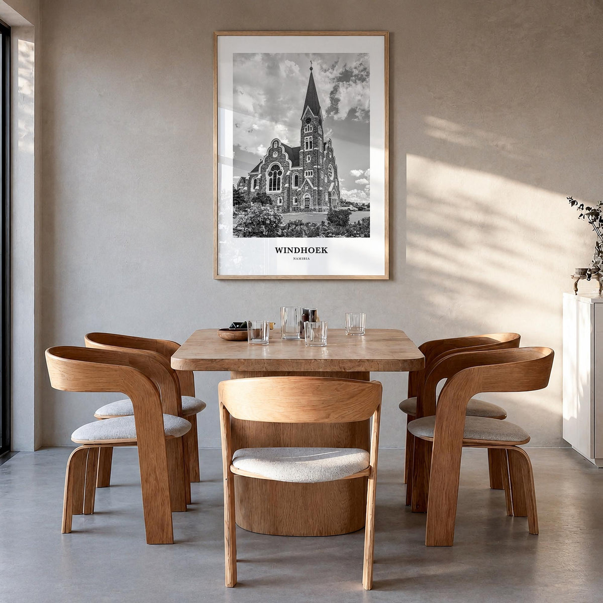 Windhoek black & white classic poster of Namibia – vertical wall art in natural wood frame, hanging on wall