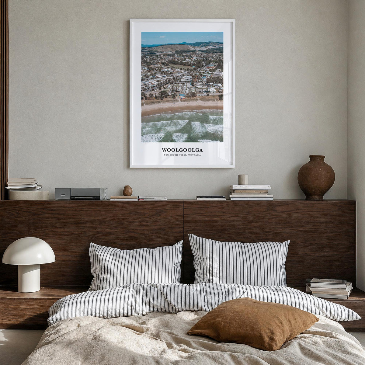 Woolgoolga colorful classic poster of Australia – vertical wall art in white wood frame, hanging on wall