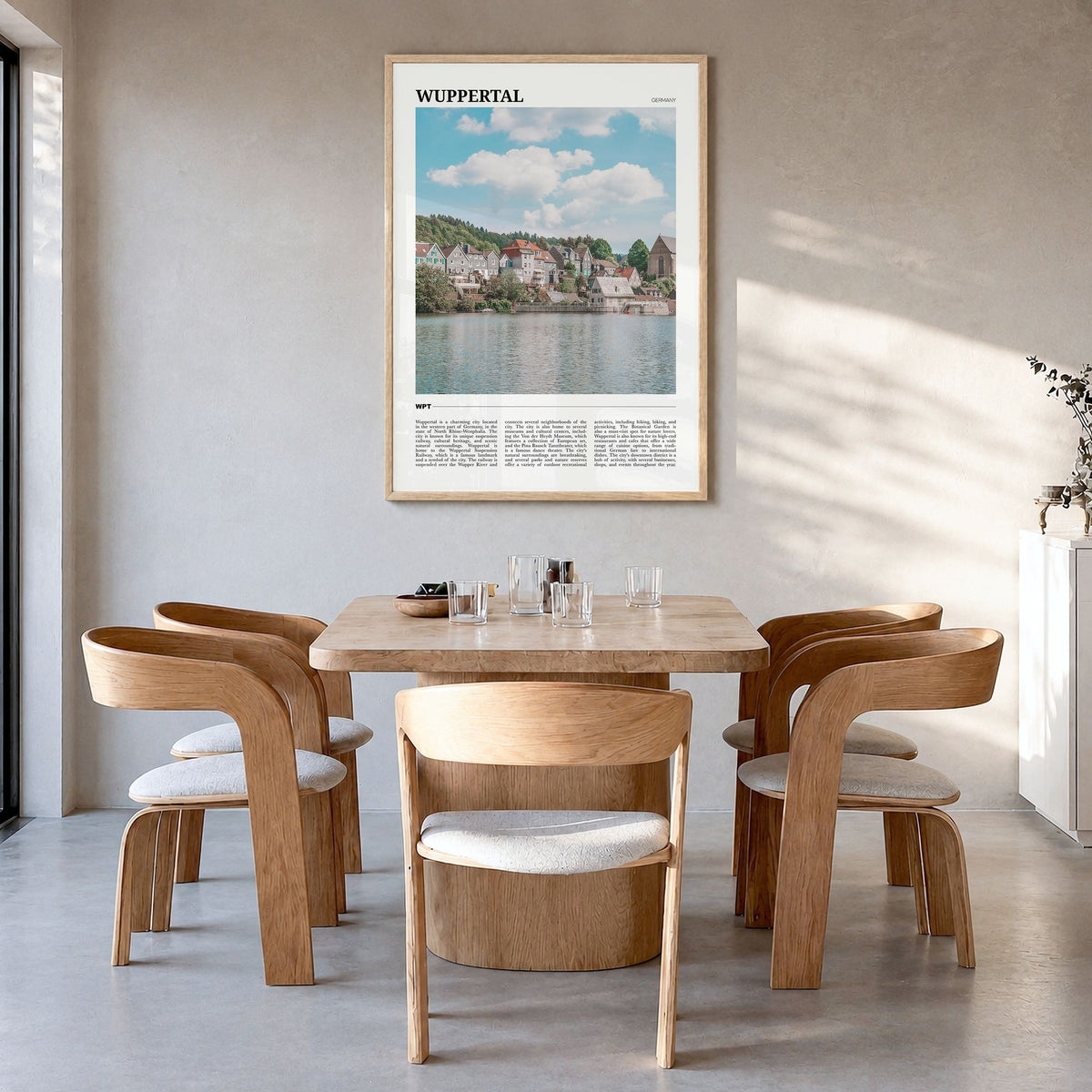 Wuppertal Travel Poster in a natural wood frame, hanging in a dining room