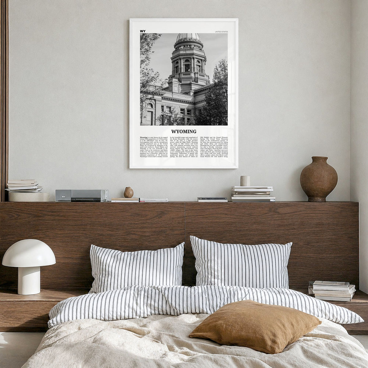 Wyoming Newspaper No 3 Poster in a white wood frame, hanging in a bedroom